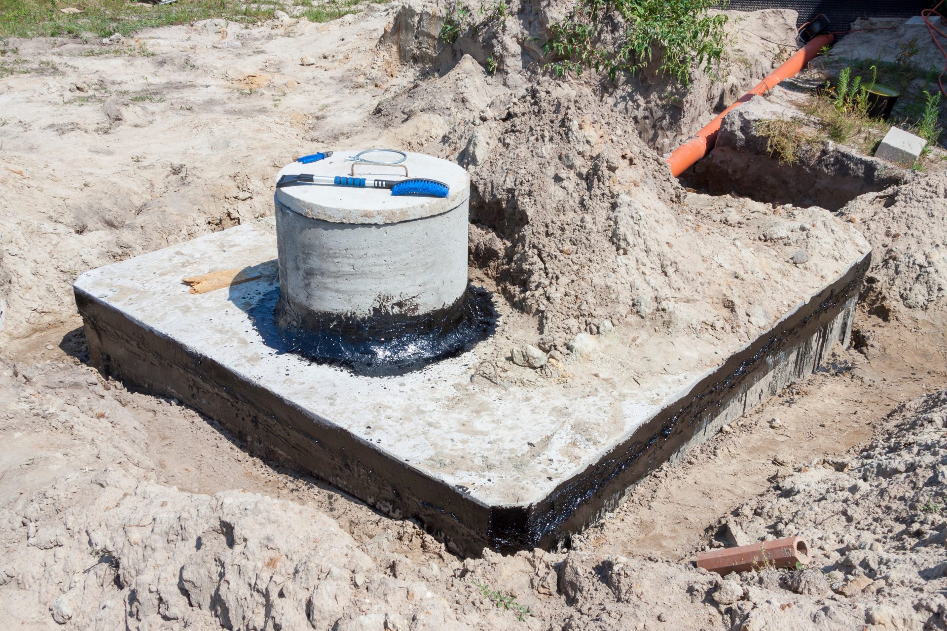 Concrete Septic Tank Being Dug Up In Yard