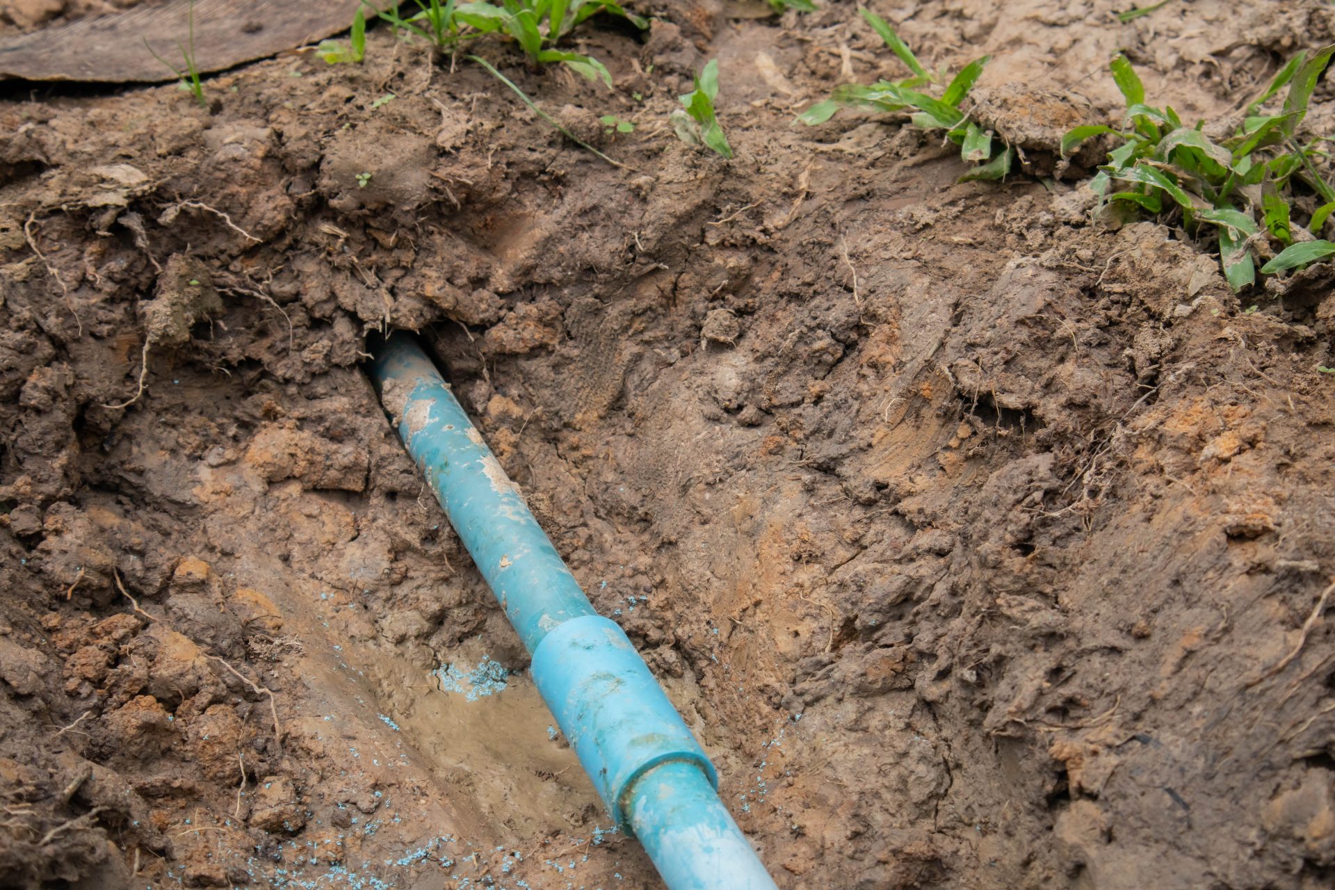 Exposed Pipe Going Into Home