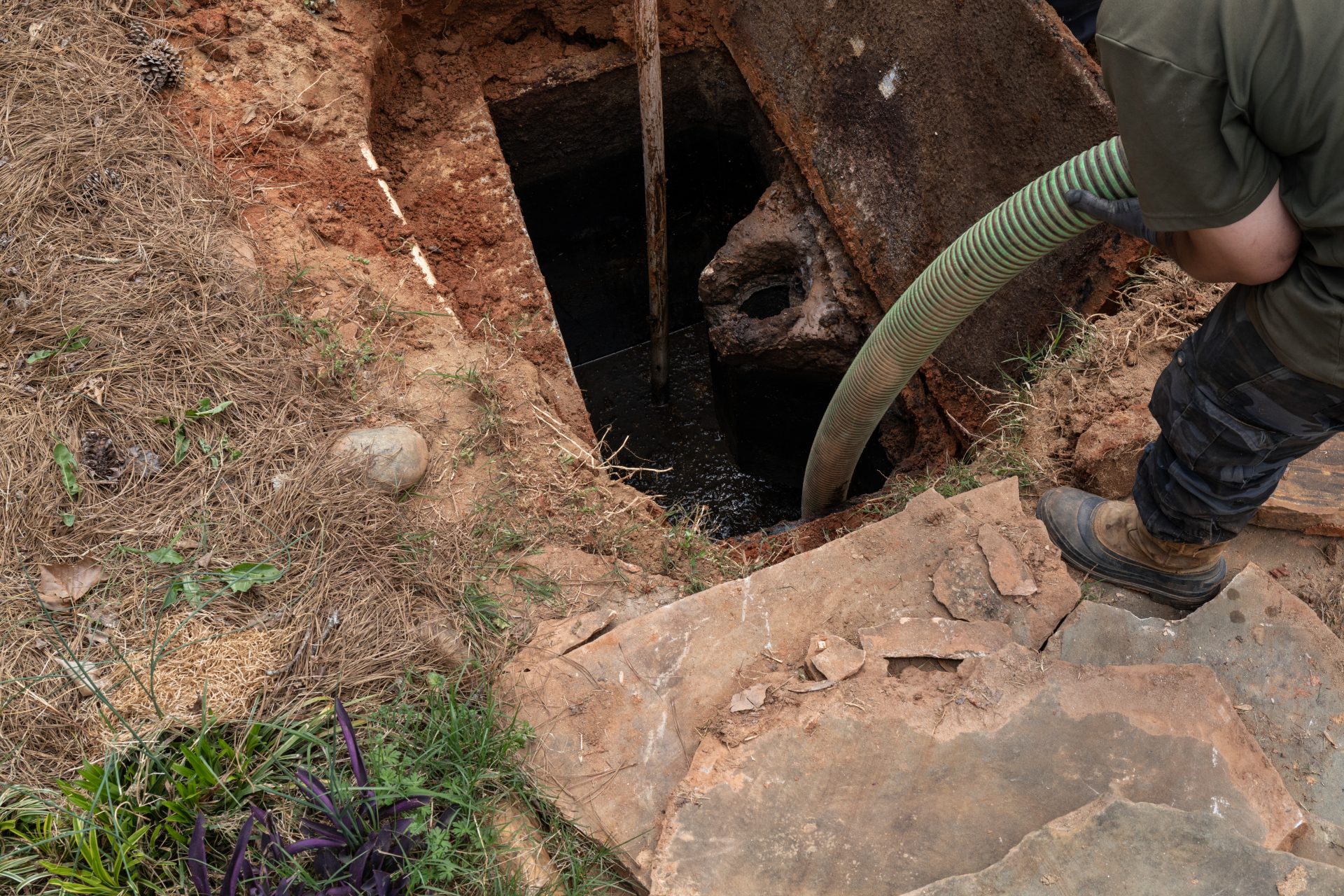 Septic tank pumping in progress.