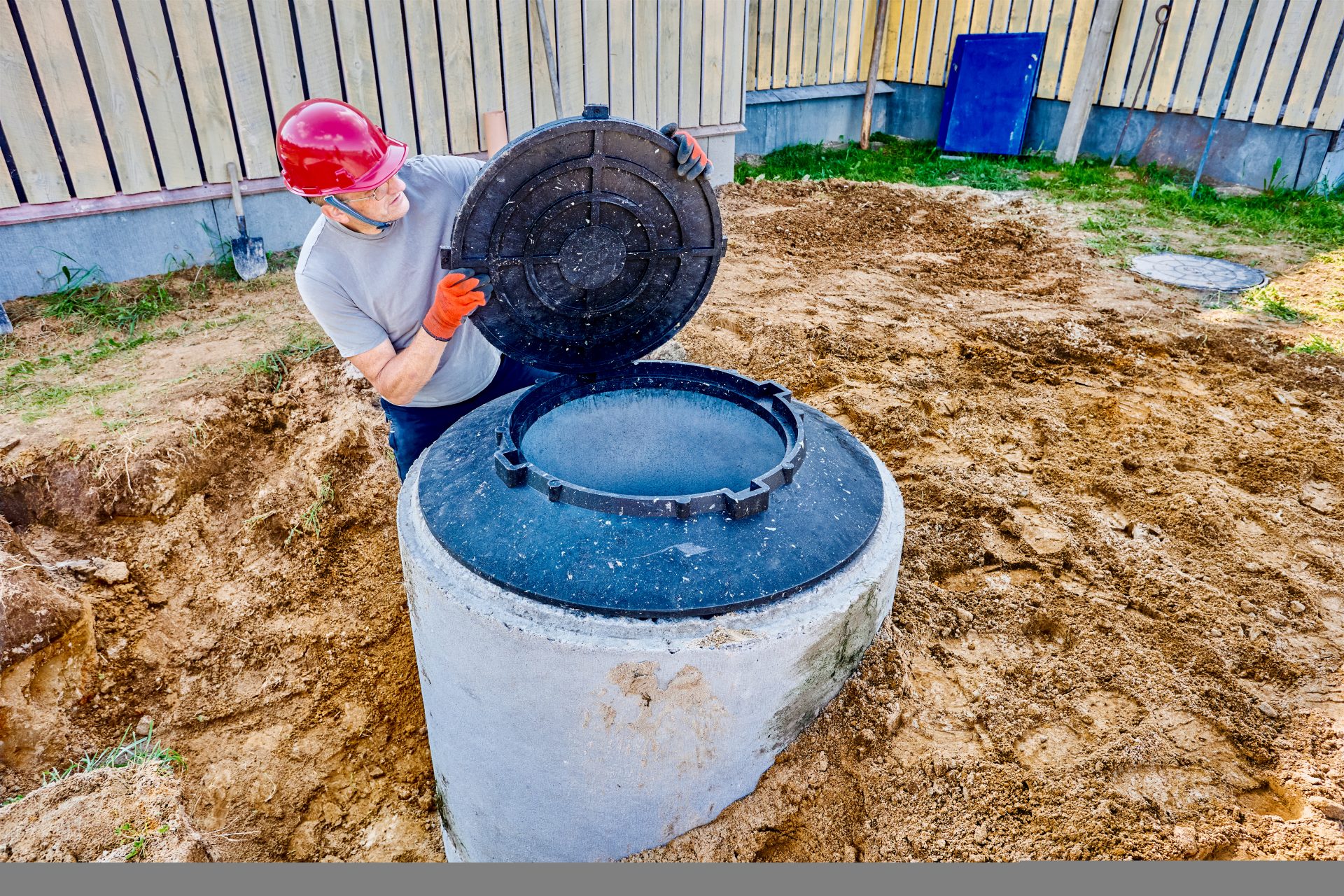Fortunate Plumbing & Rooter Services In East Sonora, CA | Avalon Rooter Exposed orange pipes are on top of dirt, though some of them are partially buried. There is a shovel stuck into the ground on the right side of the image.